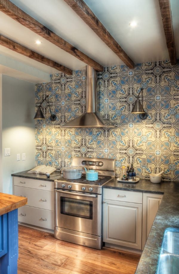 Create a decorative kitchen backsplash with cement tiles