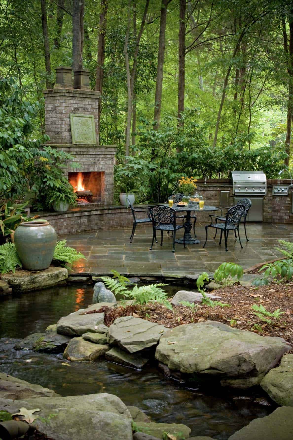 woodsy-outdoor-kitchen-with-a-fireplace