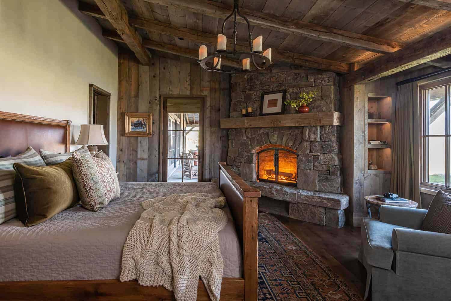 log cabin style bedroom with a fireplace