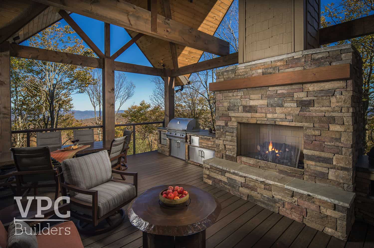 timber-frame-mountain-retreat-covered-patio-fireplace