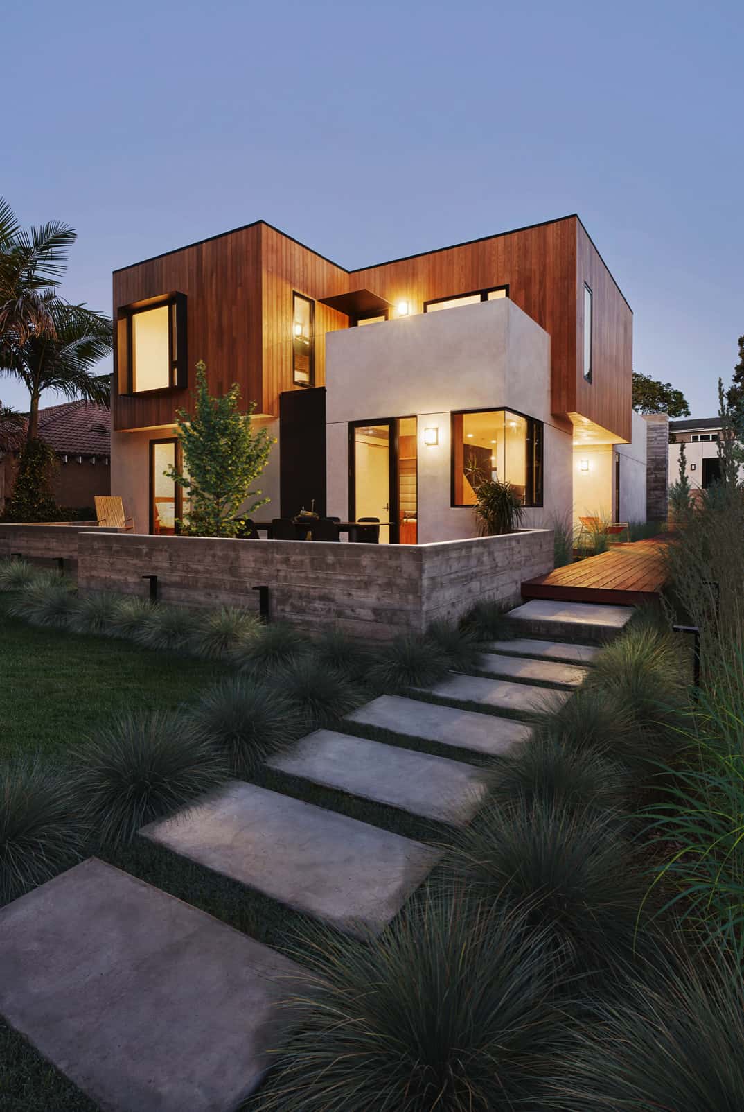 contemporary-home-exterior-entry-deck-at-dusk