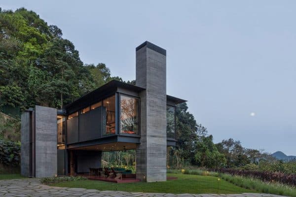 featured posts image for A modern steel and glass box shelter hovers over the Brazilian jungle