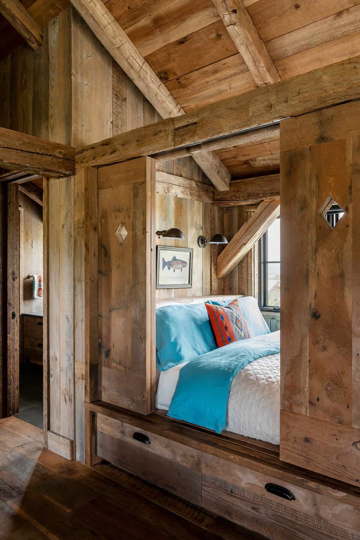 dutch-barn-built-in-window-seat-bed-with-sliding-barn-doors