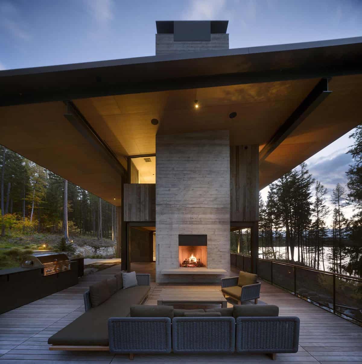 modern-lake-house-patio-with-a-fireplace