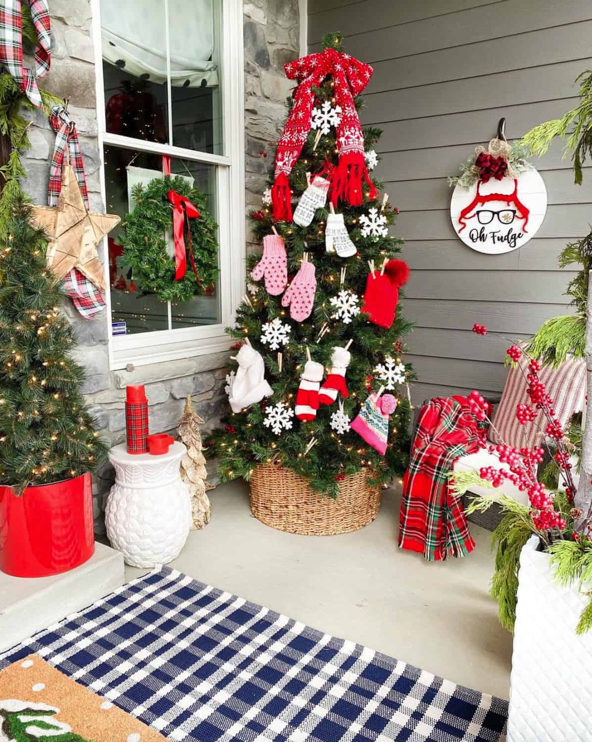 christmas-tree-with-mitts-hats-and-snowflake-ornaments-on-the-front-porch