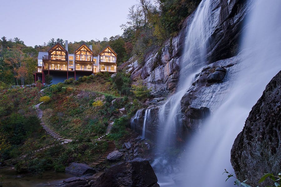 contemporary-mountainside-retreat-with-waterfall-view-at-dusk