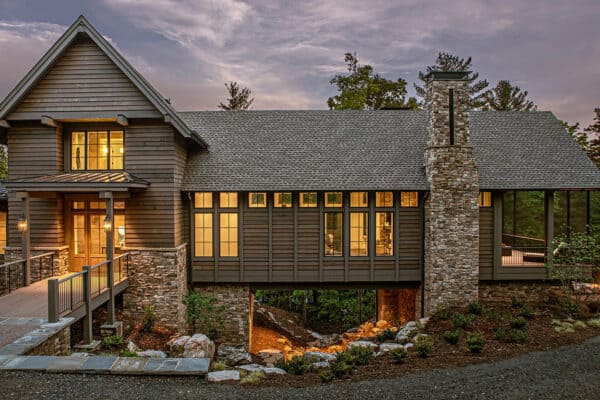 featured posts image for A refined lake house bridged across a rocky ravine in North Carolina