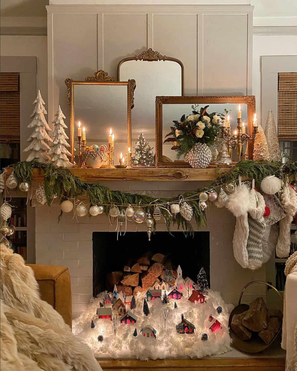 holiday-decorated-mantel-with-a-garland-and-a-christmas-village