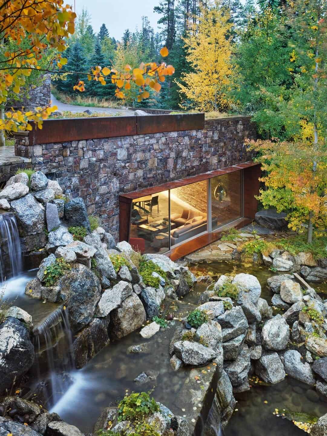 mountainside-wine-cellar-exterior-with-a-waterfall