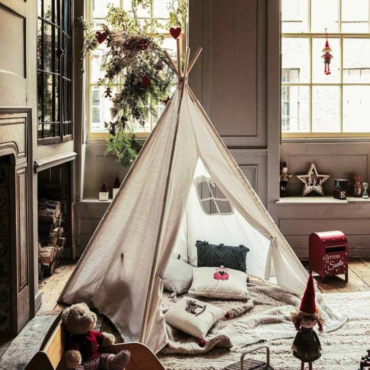 kids-playroom-with-a-tepee-pillows-and-christmas-decor