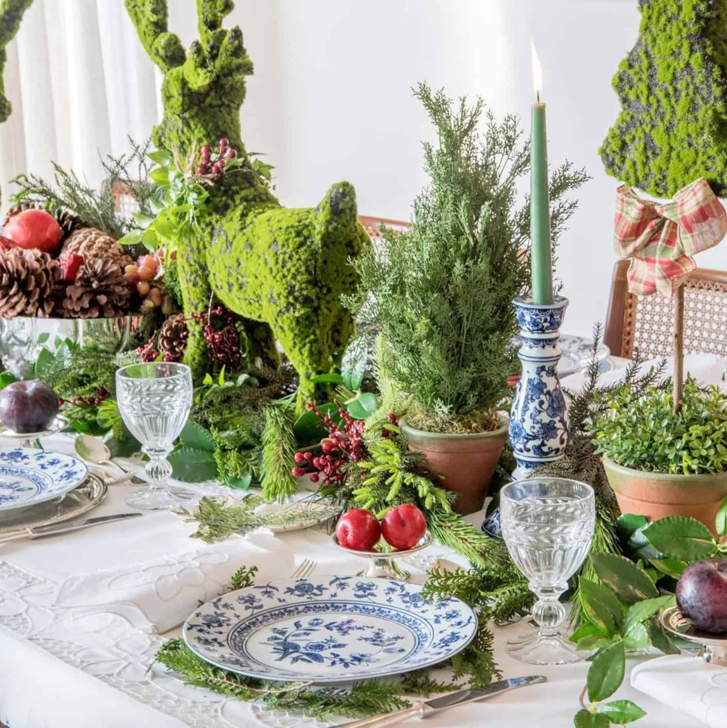 festive-christmas-dining-table-with-greenery-and-reindeer