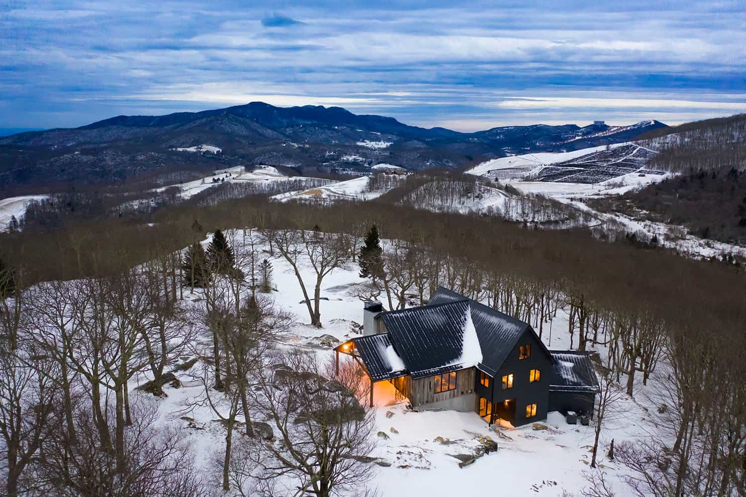 contemporary-mountain-home-exterior-with-snow