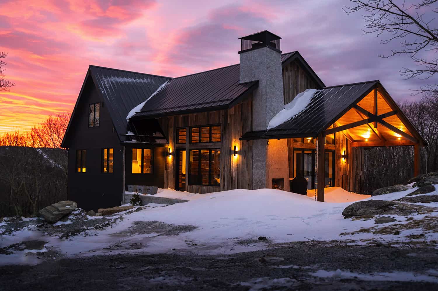contemporary-mountain-home-exterior-with-snow-at-dusk