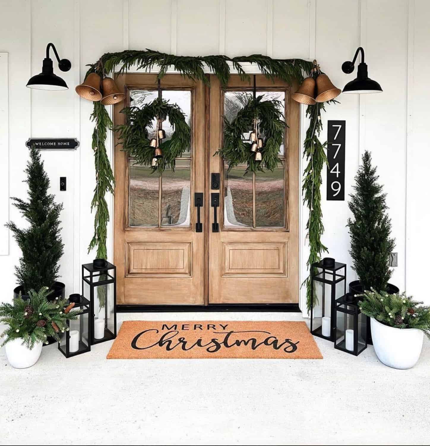 front-porch-christmas-decor-with-garland-and-trees