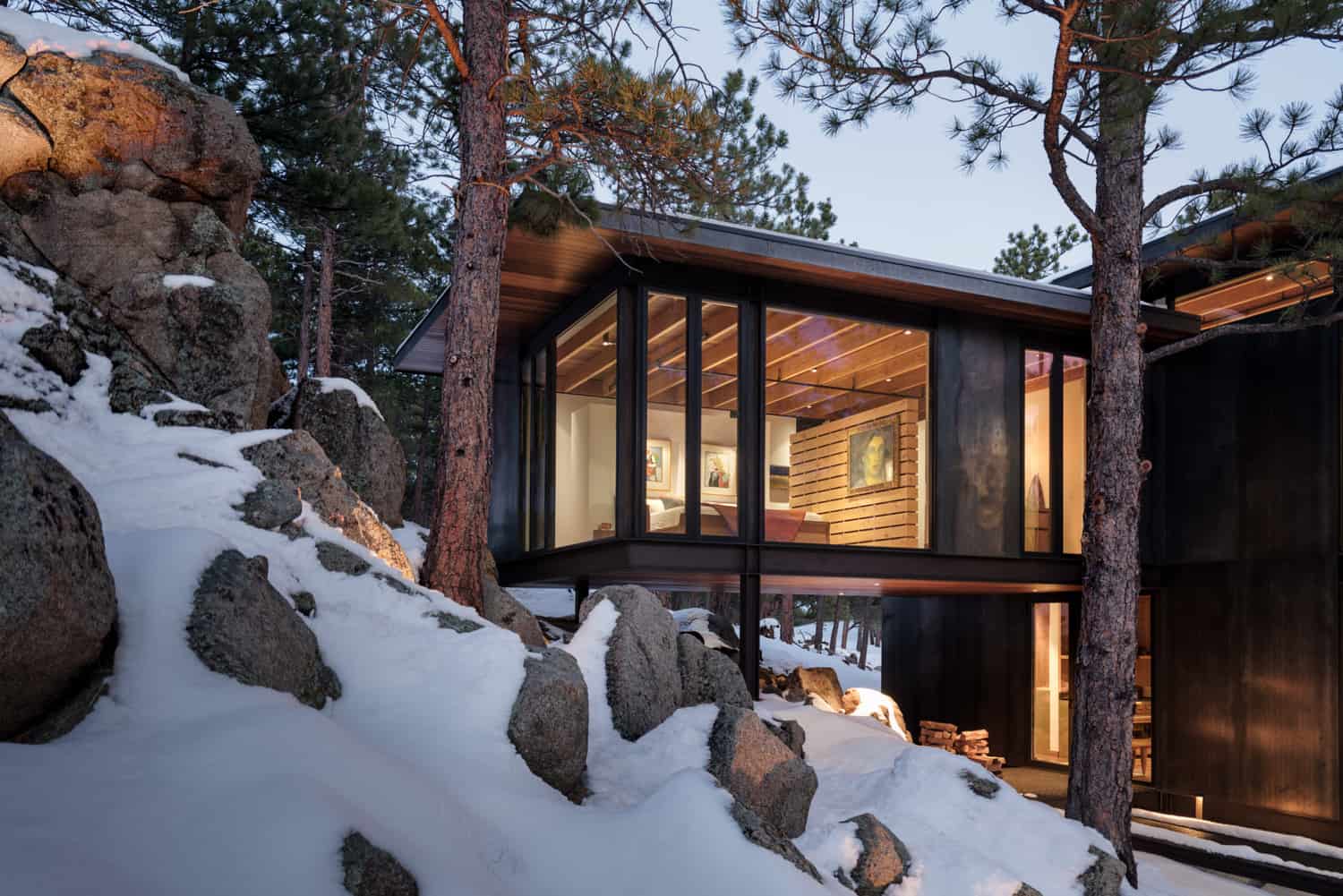steel-clad-home-exterior-with-snow-dusk