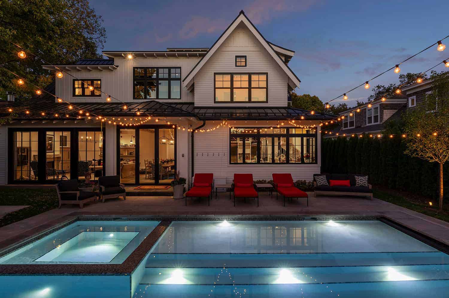 transitional-family-home-exterior-with-swimming-pool