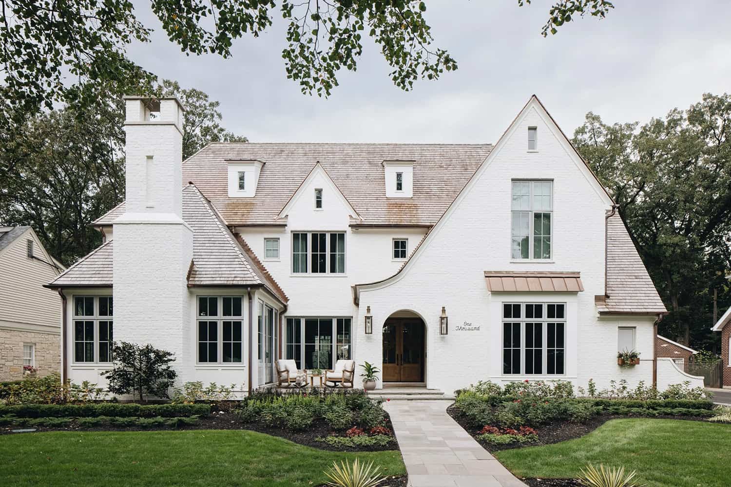 Tour this absolutely stunning and timeless white brick house in