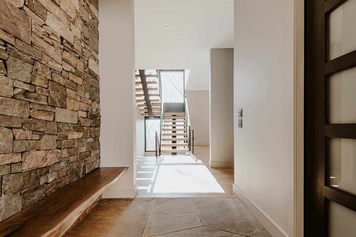 mountain-home-entry-with-staircase-view