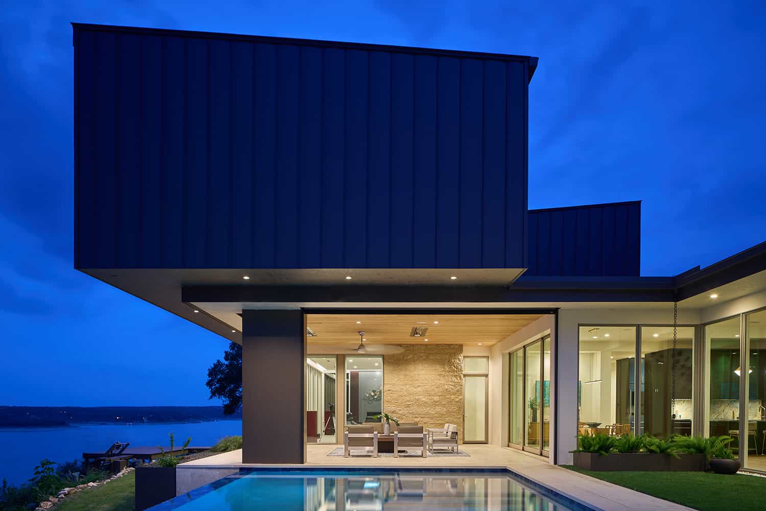 modern-cliffside-lake-house-pool-dusk