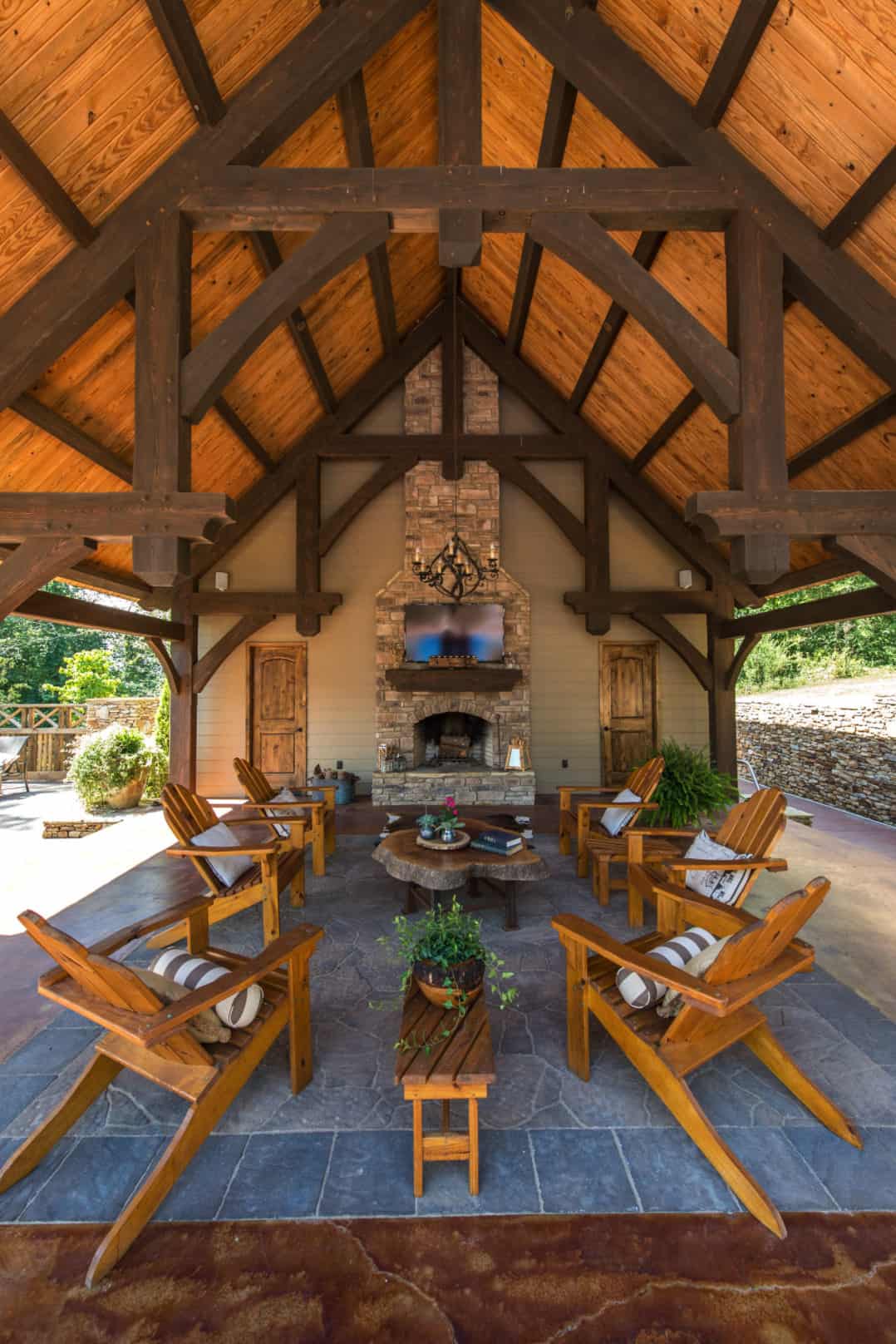 rustic-covered-patio-with-a-dramatic-fireplace
