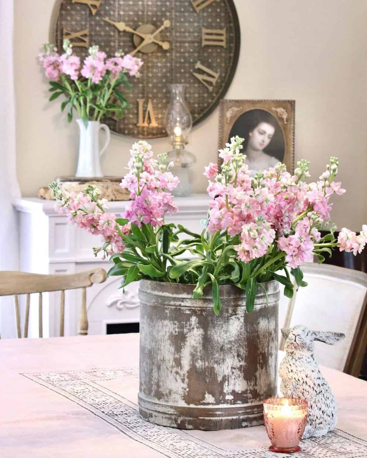 dining-table-with-a-metal-bucket-filled-with-flowers