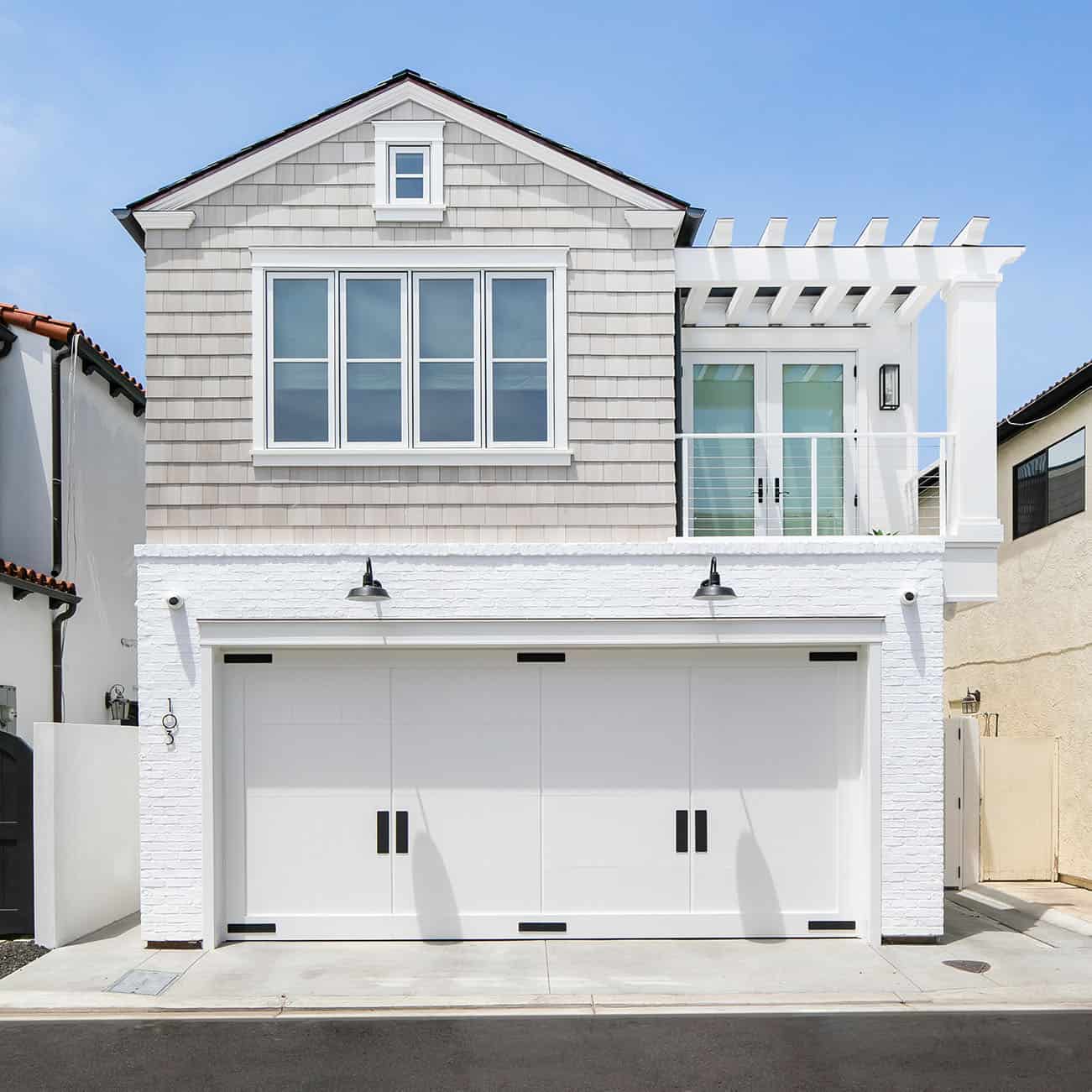 cape-cod-style-home-exterior-with-a-garage