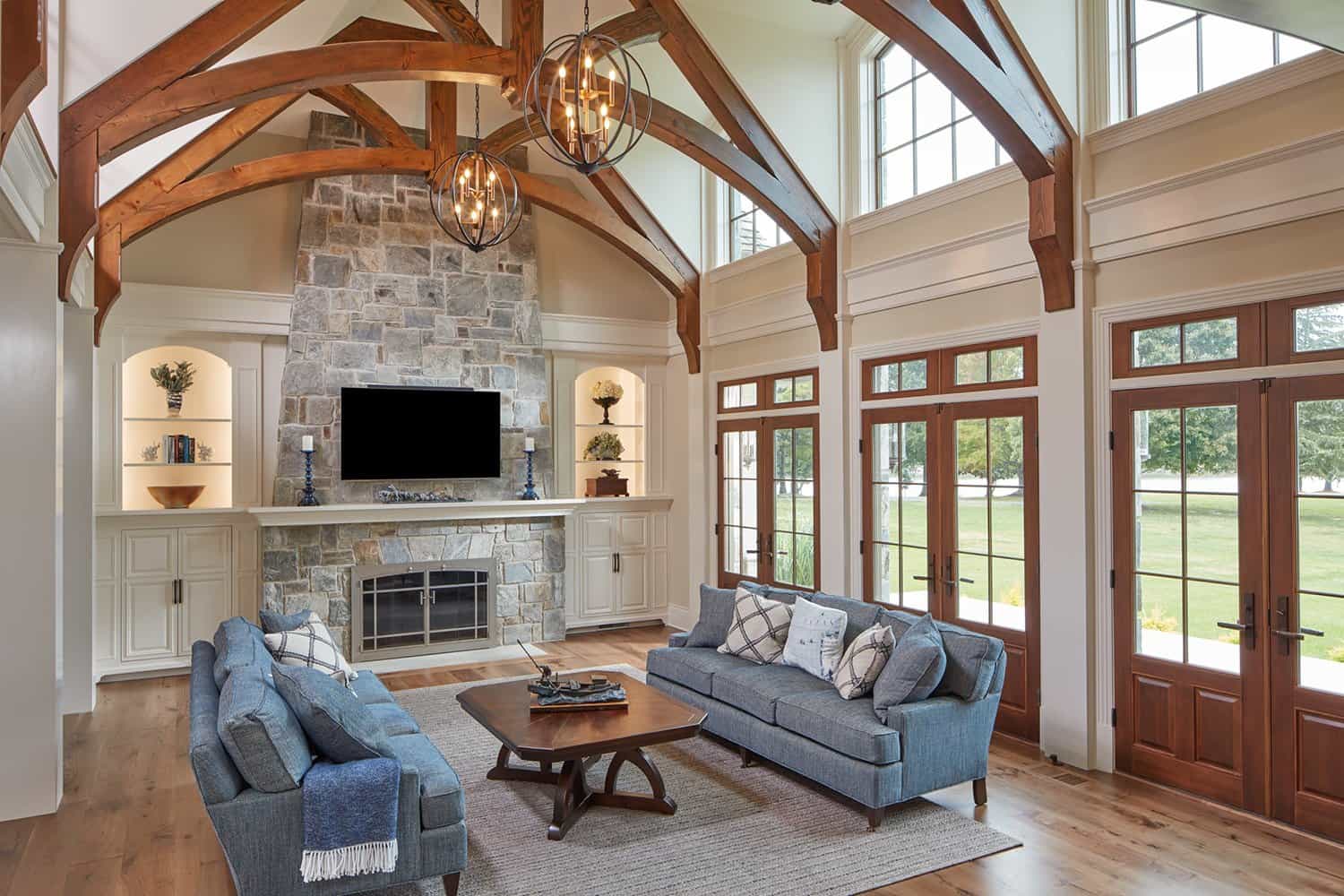 french-provincial-style-living-room-with-a-stone-fireplace