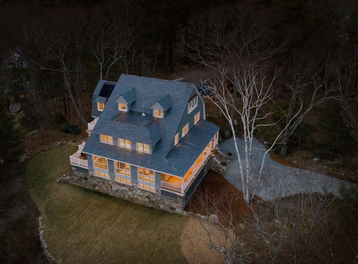 shingle-style-house-exterior-aerial-view-at-dusk