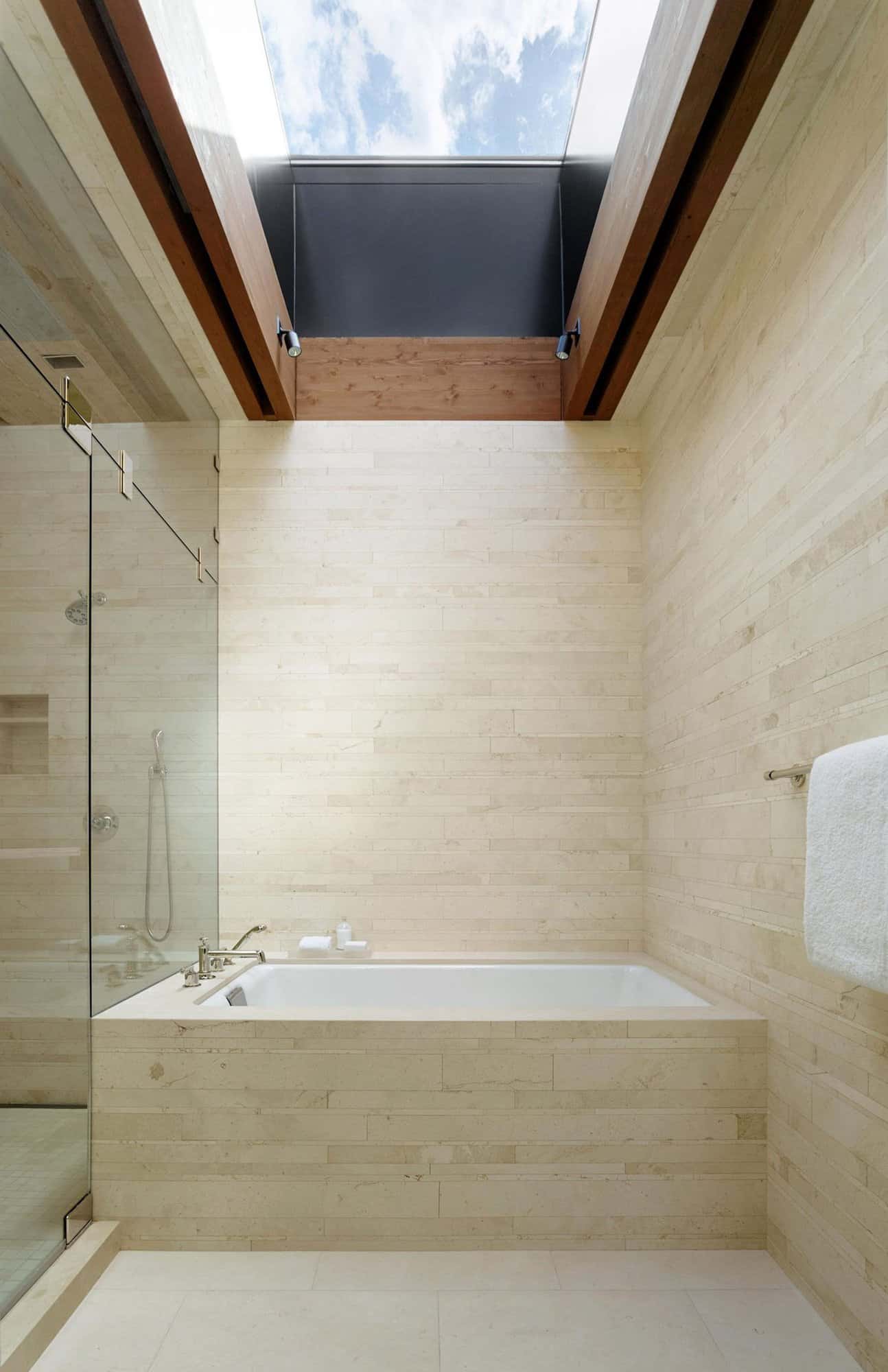 modern-bathroom-with-tub-shower-and-skylight