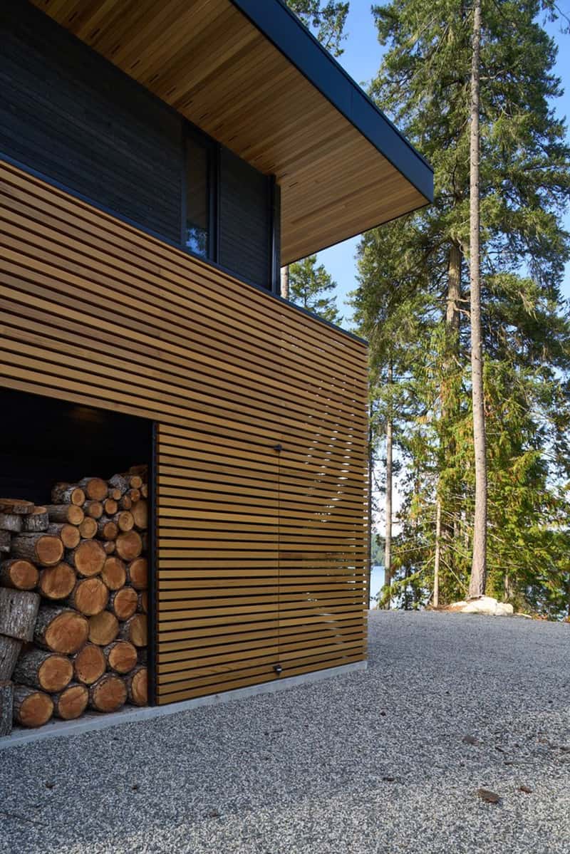 modern-lake-house-retreat-exterior-with-fire-wood-storage
