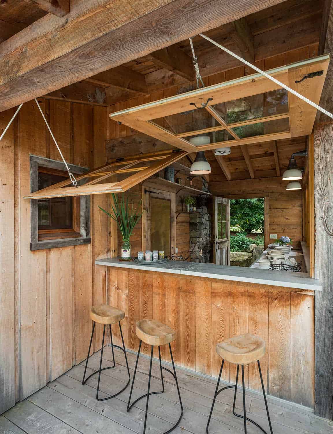 rustic-outdoor-kitchen-with-windows-on-a-pulley-system