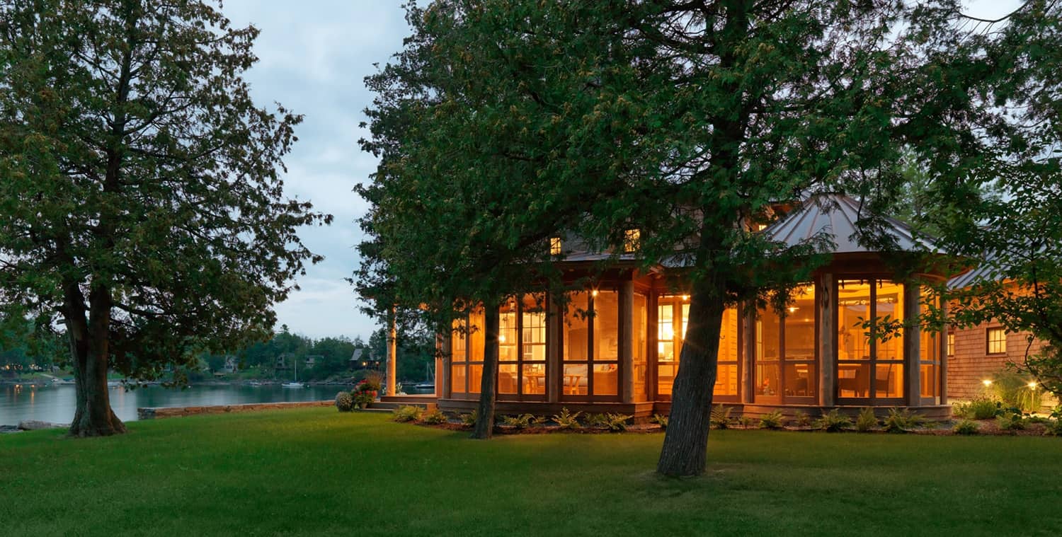 camp-style-lake-home-exterior-at-dusk
