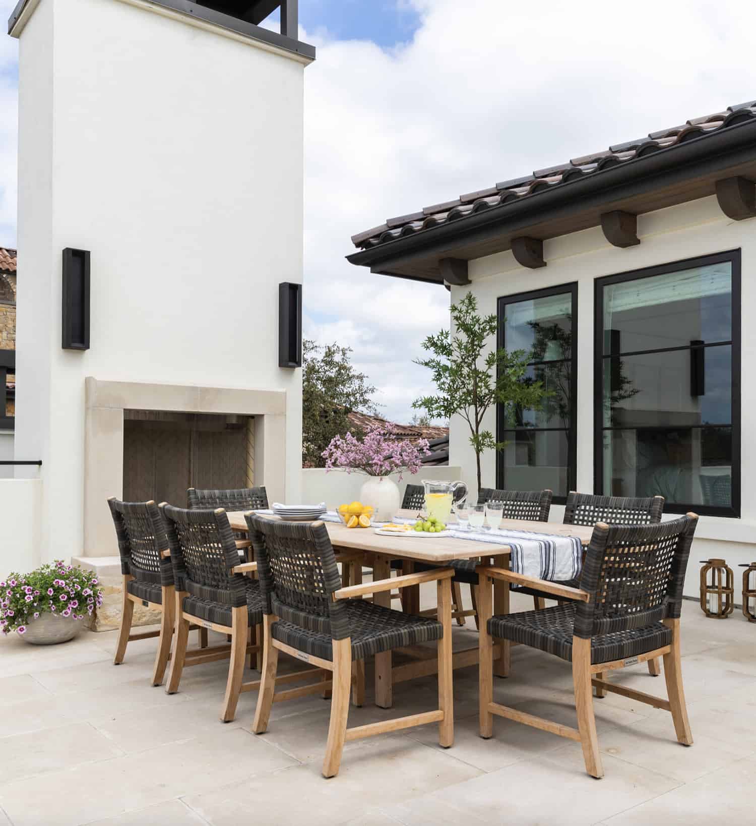 contemporary-patio-with-outdoor-dining-and-a-fireplace