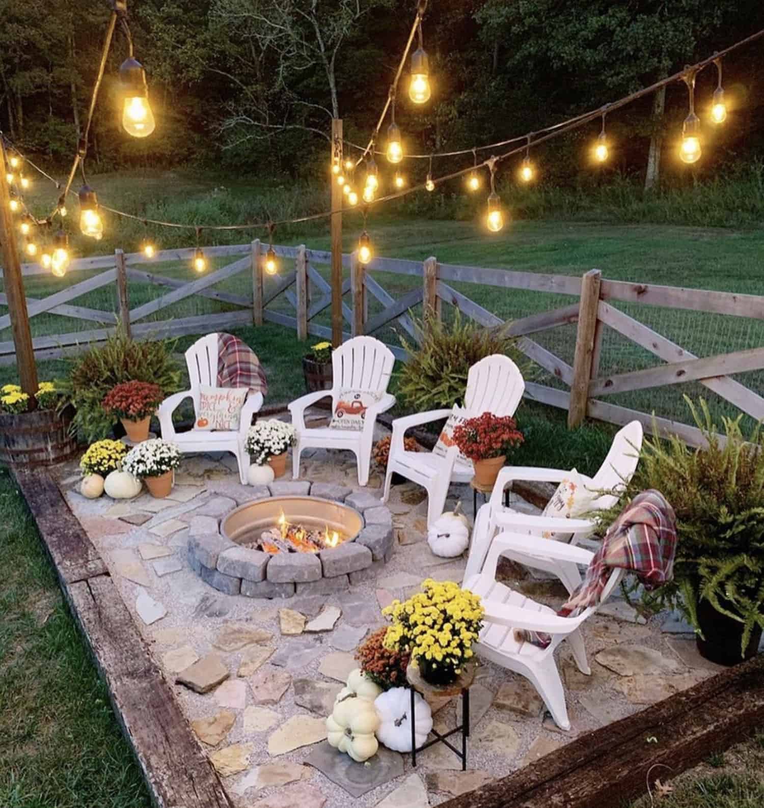 outdoor-patio-with-fireplace-twinkle-lights-and-fall-decorations