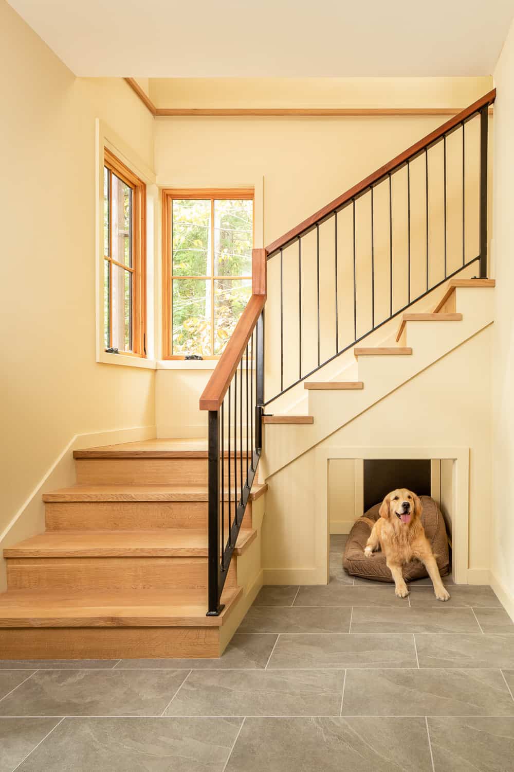 transitional-staircase-with-dog-kennel