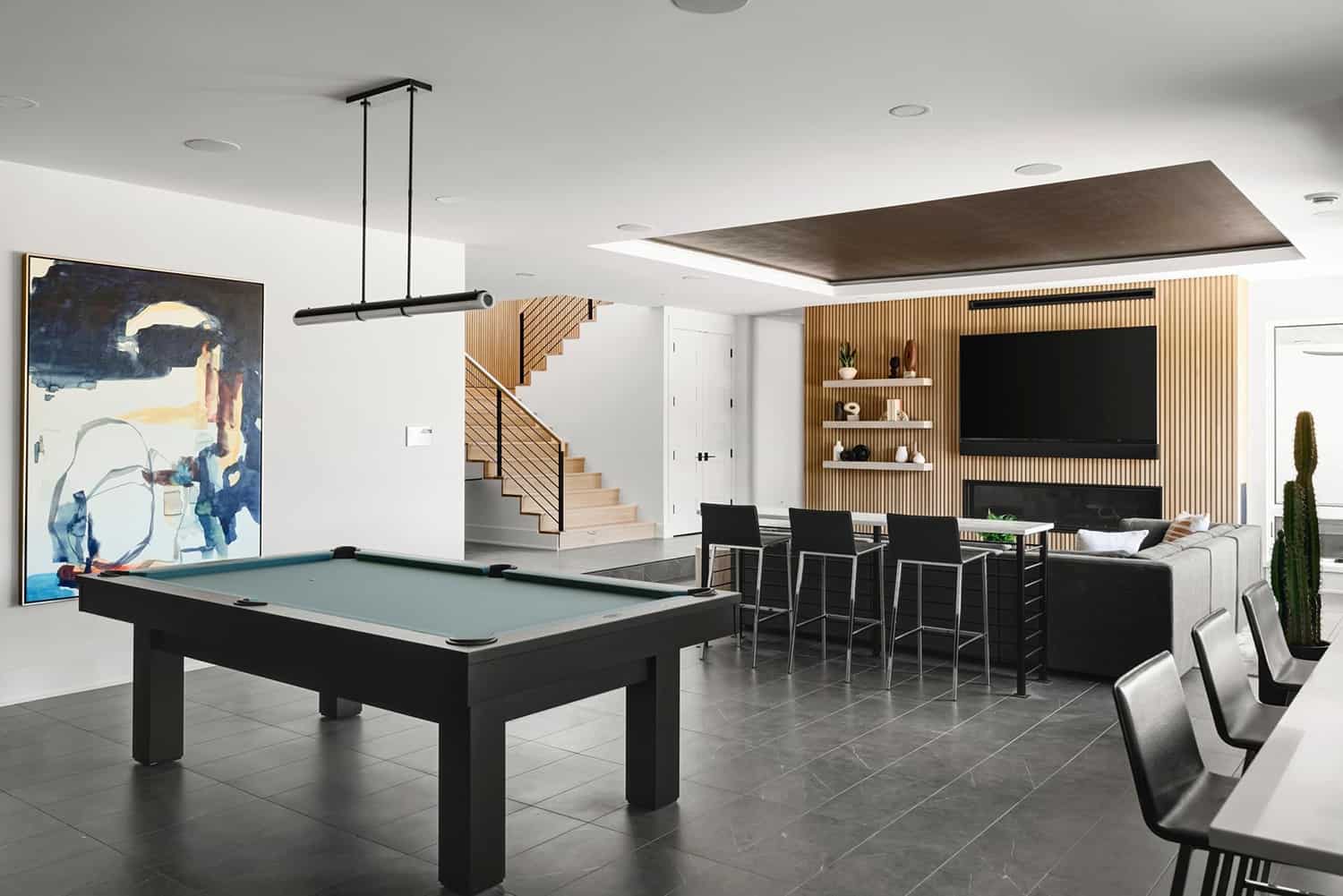 scandinavian-modern-basement-family-room-with-billiard-table