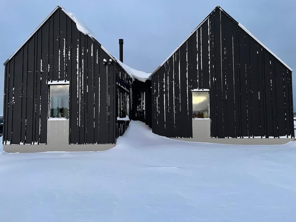 contemporary-black-home-exterior-with-snow