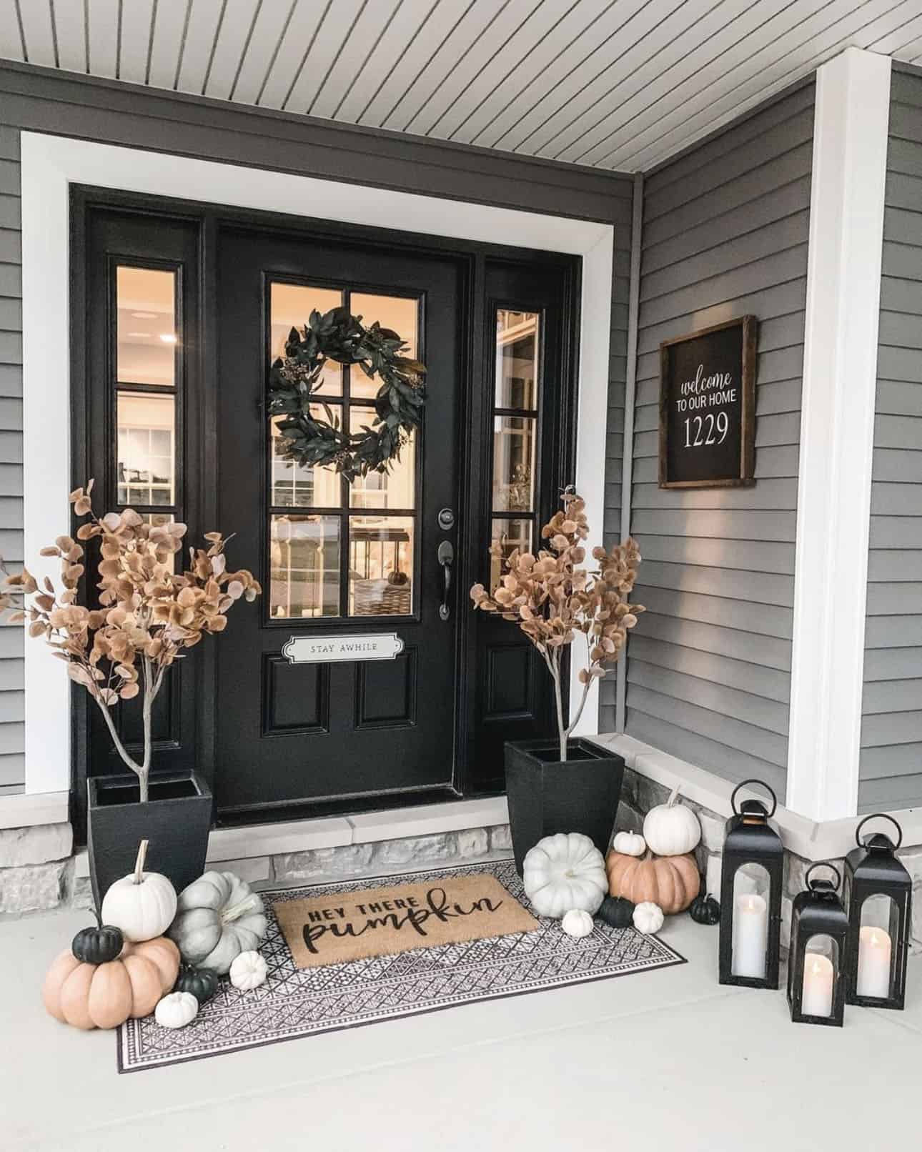 fall-front-porch-with-a-black-painted-door