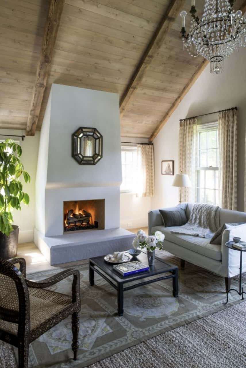 farmhouse-bedroom-sitting-room-with-a-fireplace