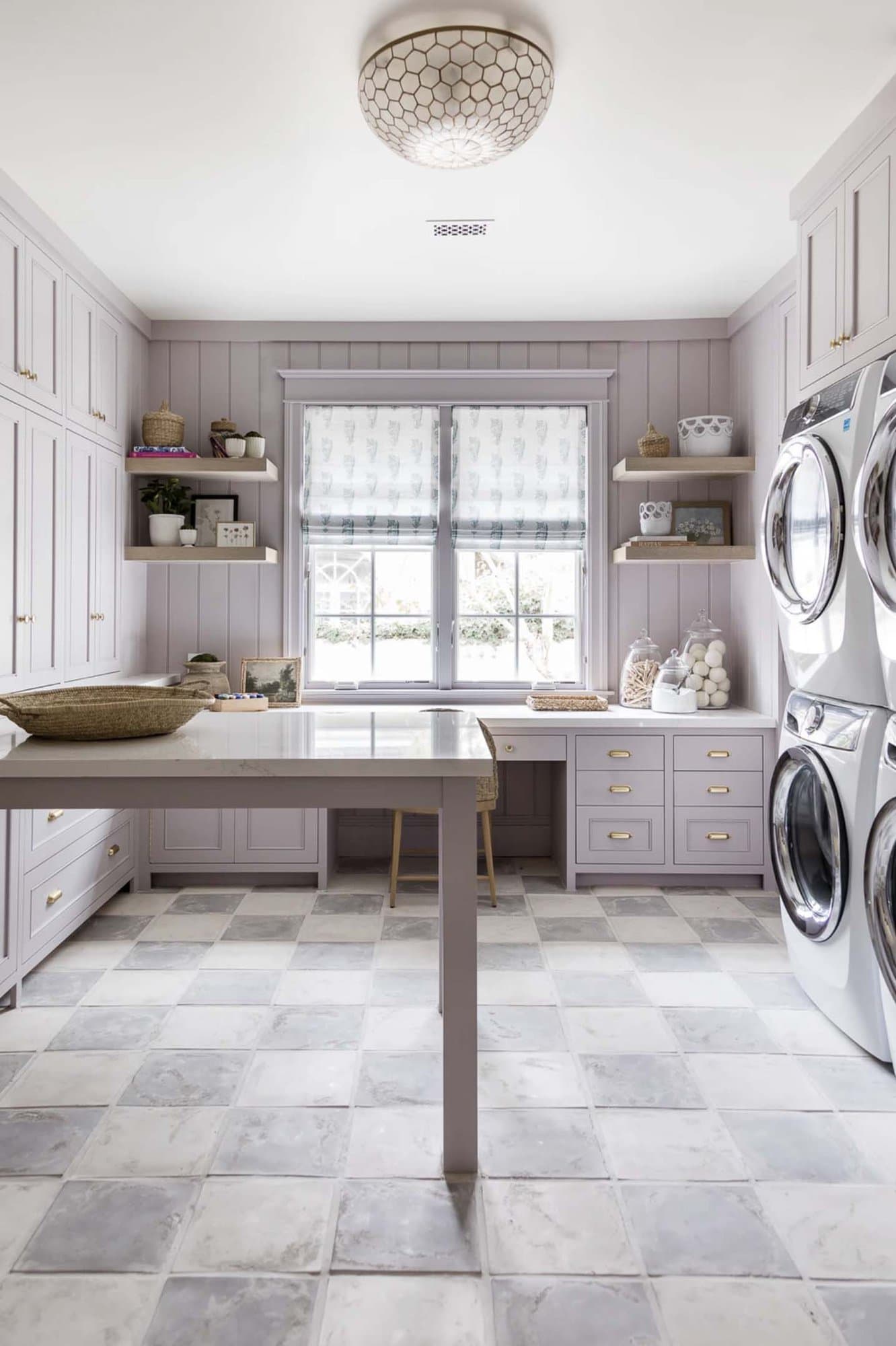 traditional style laundry room with a folding table