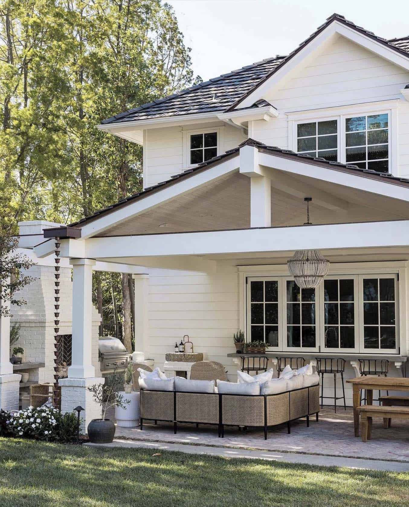 traditional style home exterior backyard with a covered porch
