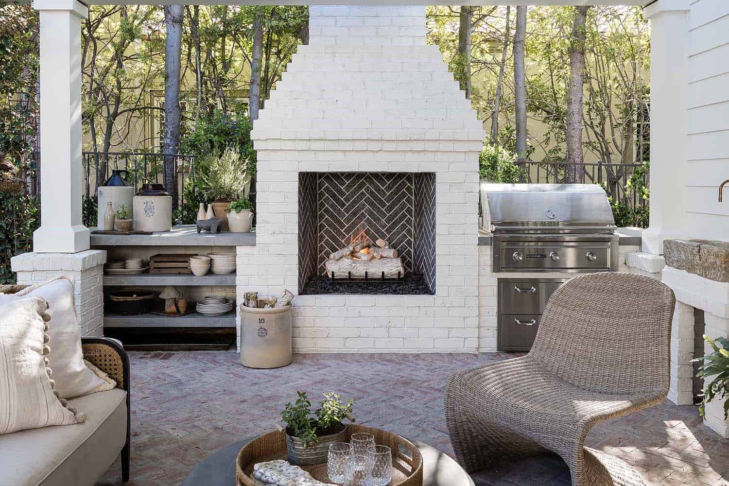 traditional style home exterior backyard with a fireplace and outdoor furniture