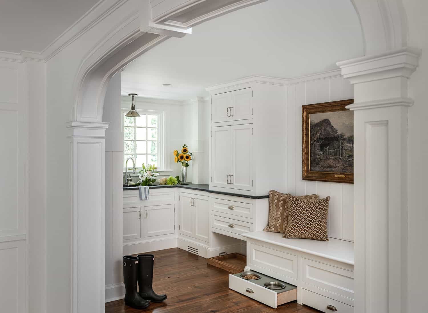 traditional-style-mudroom-with-a-pull-out-dog-bowl-station