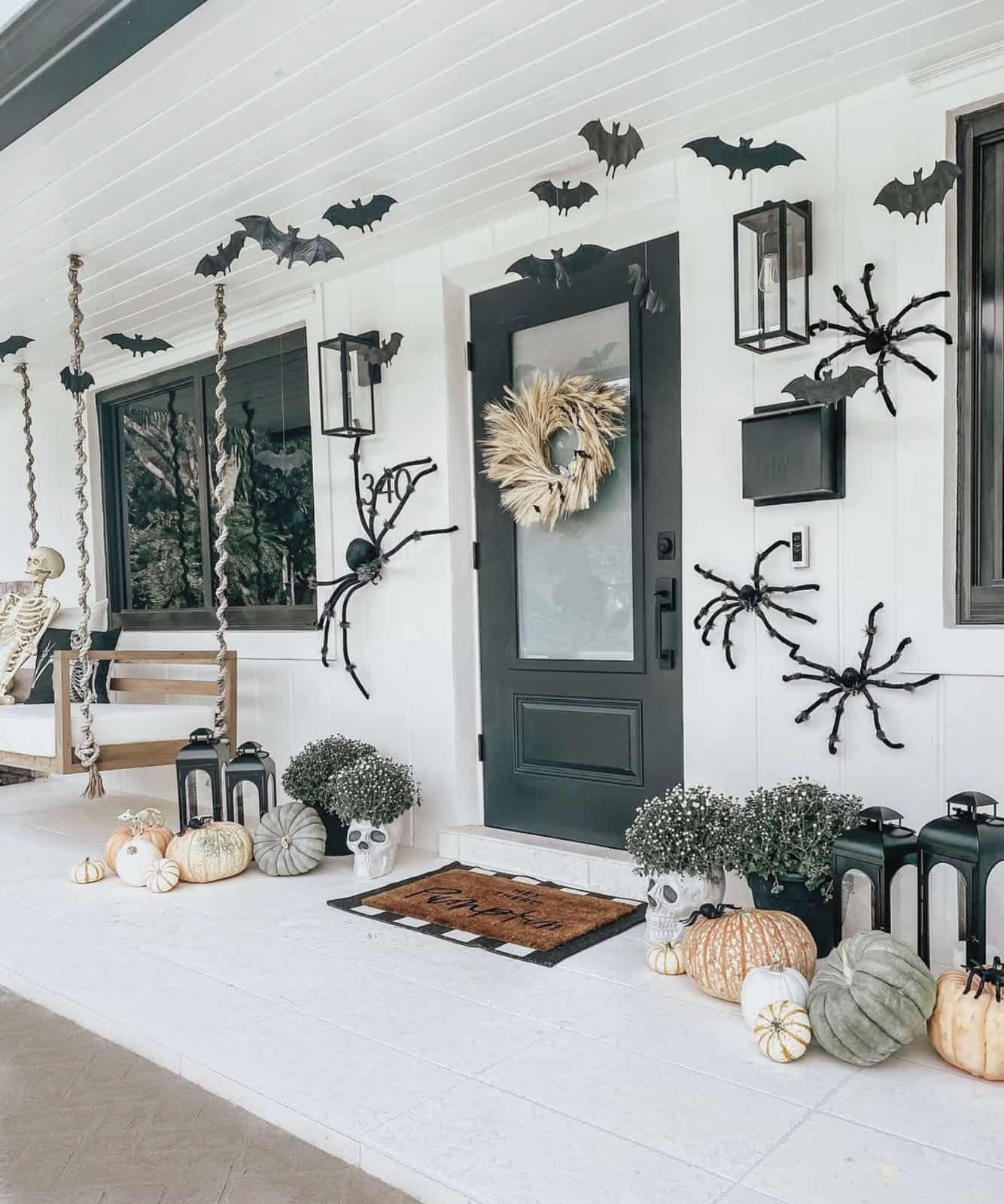 spooky-halloween-decorated-front-porch-with-spiders-and-bats