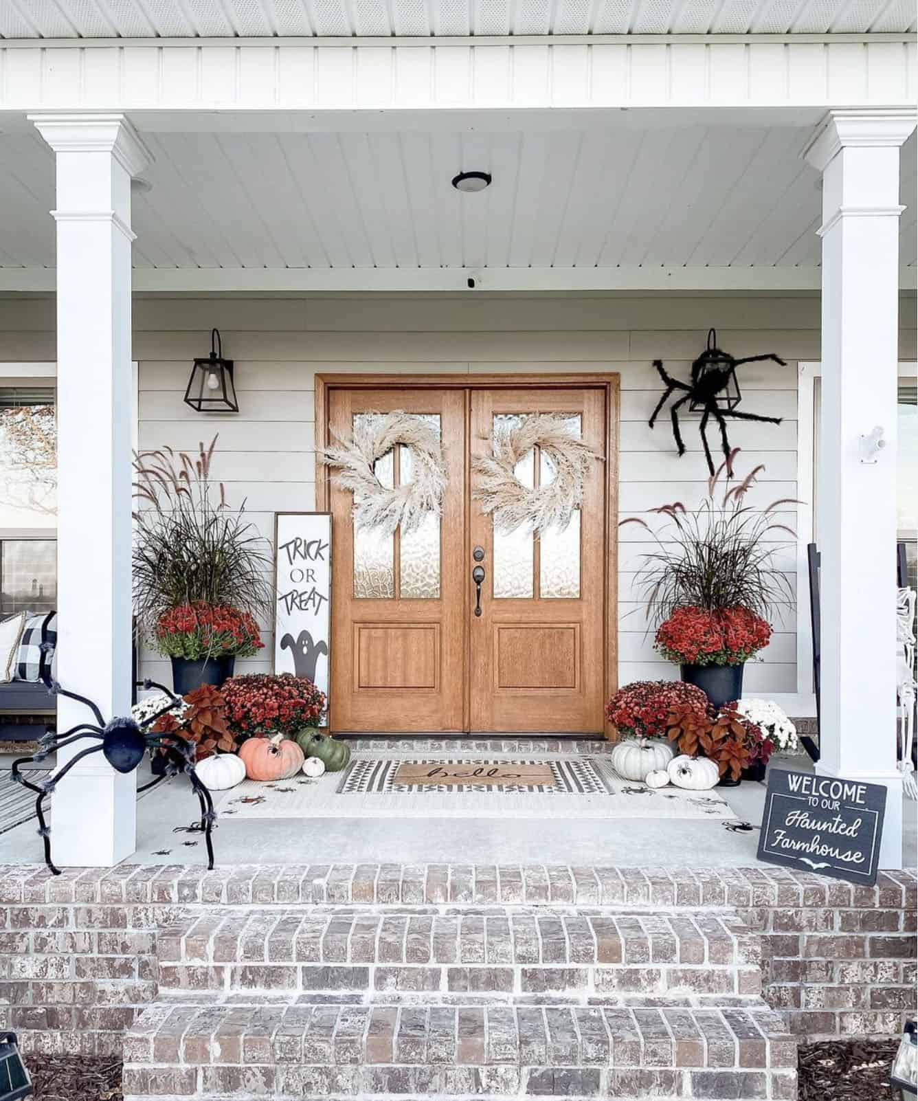 halloween-front-porch-decor-with-large-spiders