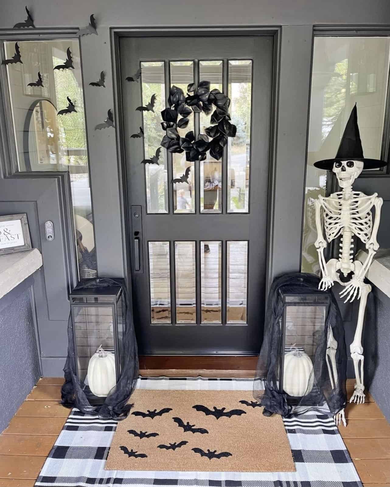 halloween-decorated-front-door-with-a-large-skeleton