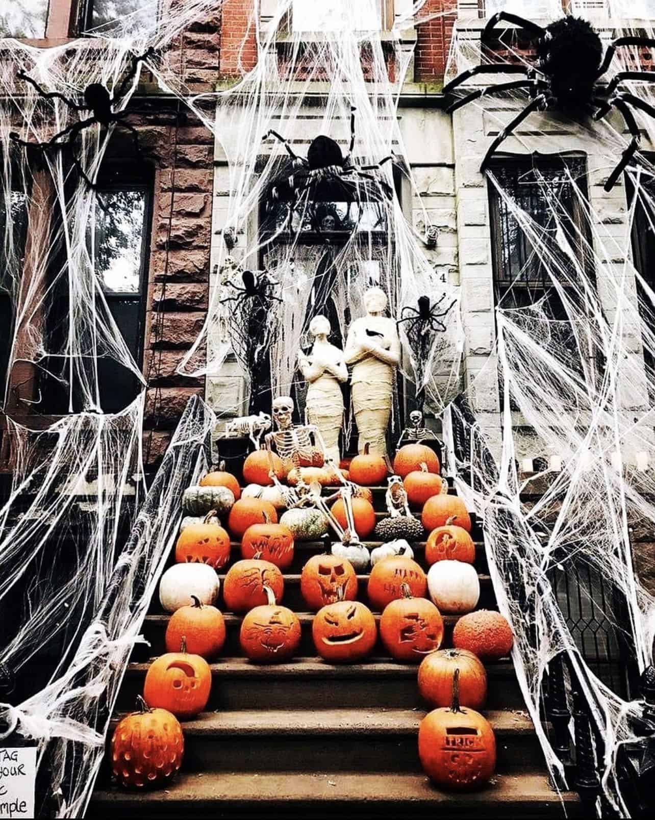 haunted-house-for-halloween-with-pumpkins-spiders-and-mummies