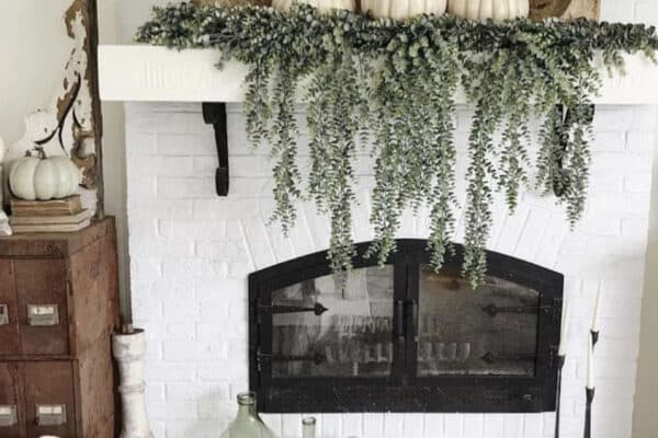 fireplace-mantel-with-a-dough-bowl-and-white-pumpkins-and-greenery