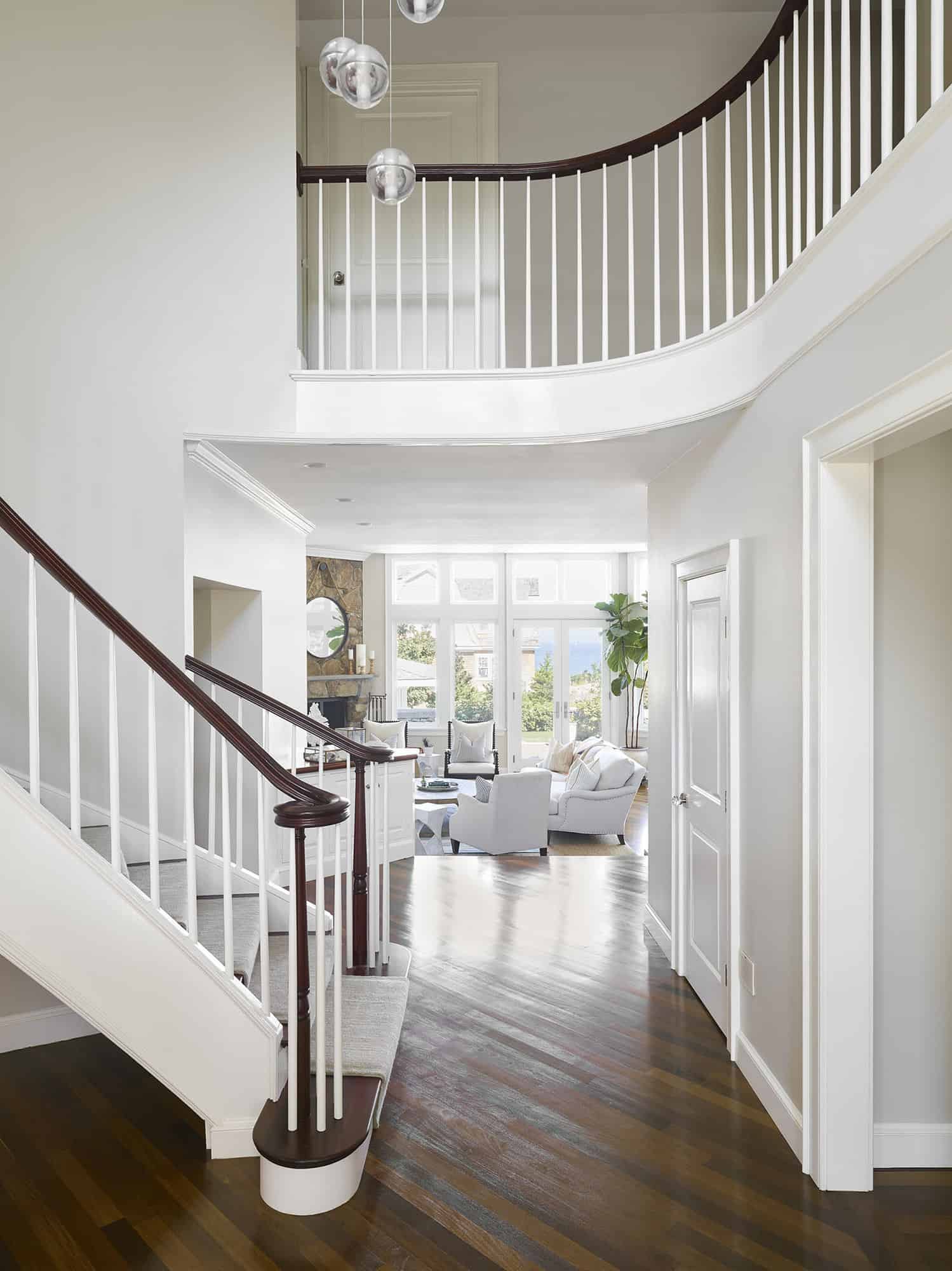 beach-style-front-foyer-and-curved-staircase