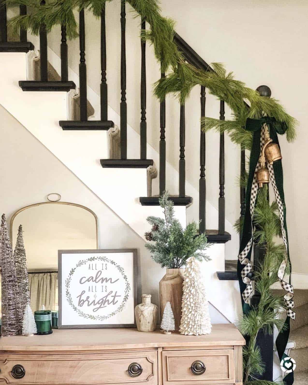 natural-garland-and-bells-for-a-christmas-decorated-staircase